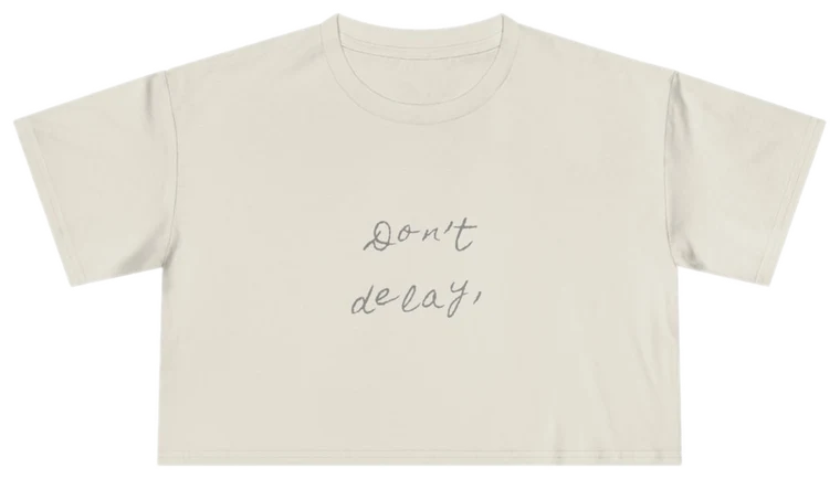 Don't Delay — Back Story Crop Tee